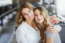 mom-young-beautiful-teenage-daughter-hug-summer-terrace-cafe-casual-clothing