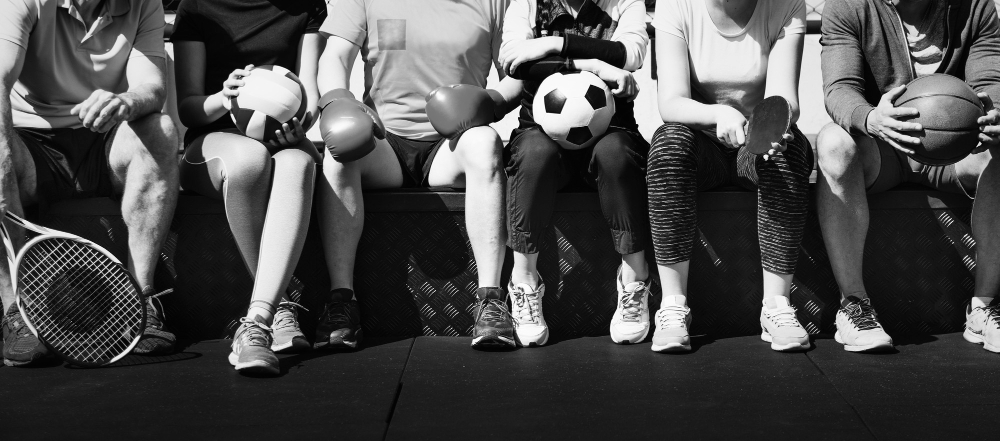 group-diverse-athletes-sitting-together